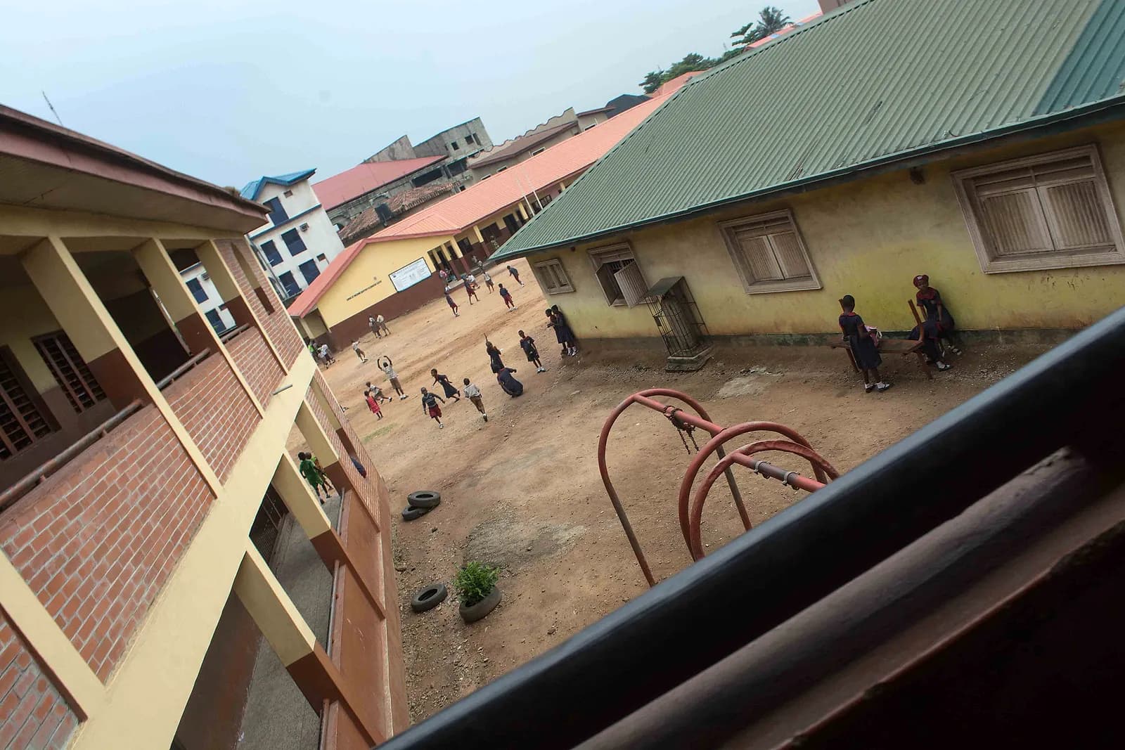 Pupils outdoors during break time at a primary school.