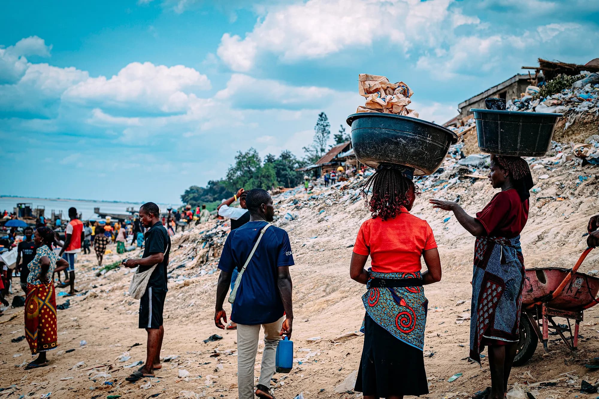 Farmers carrying produce to market.